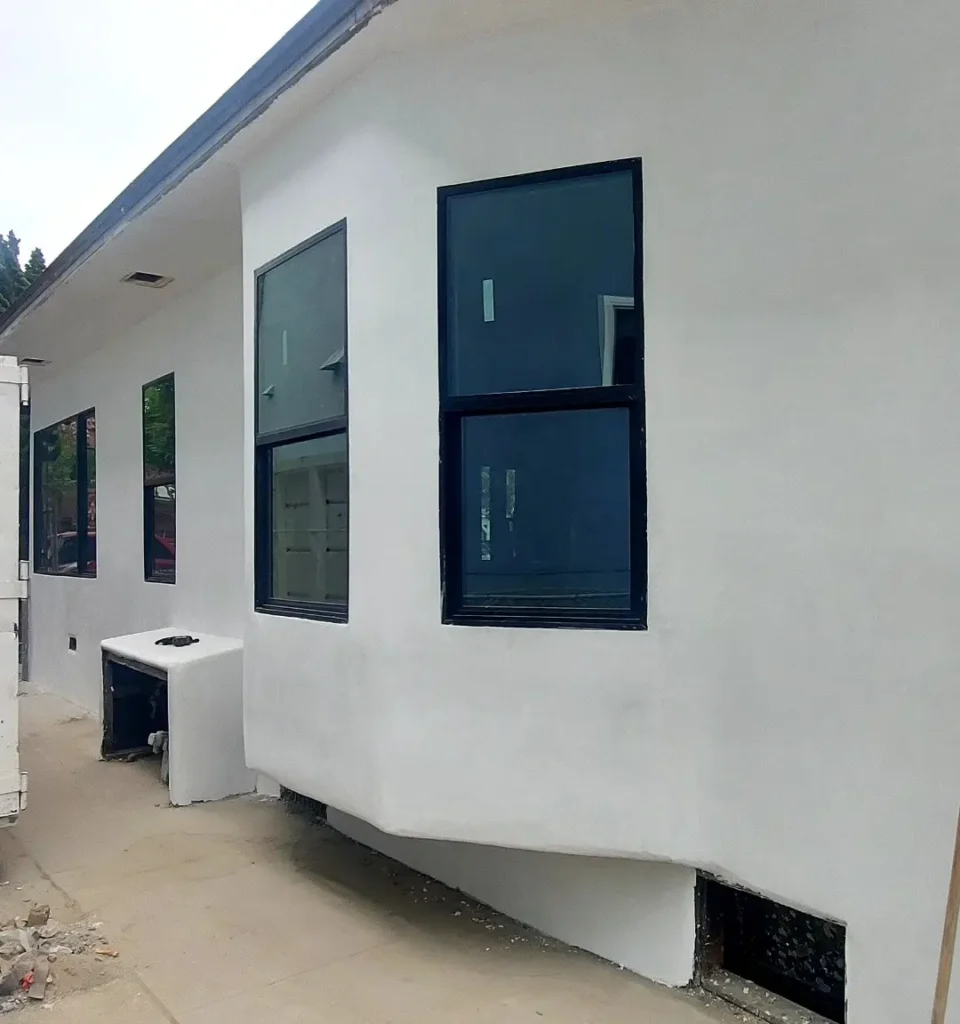 A garage conversion into a modern ADU with full kitchen, bath, and living space.
