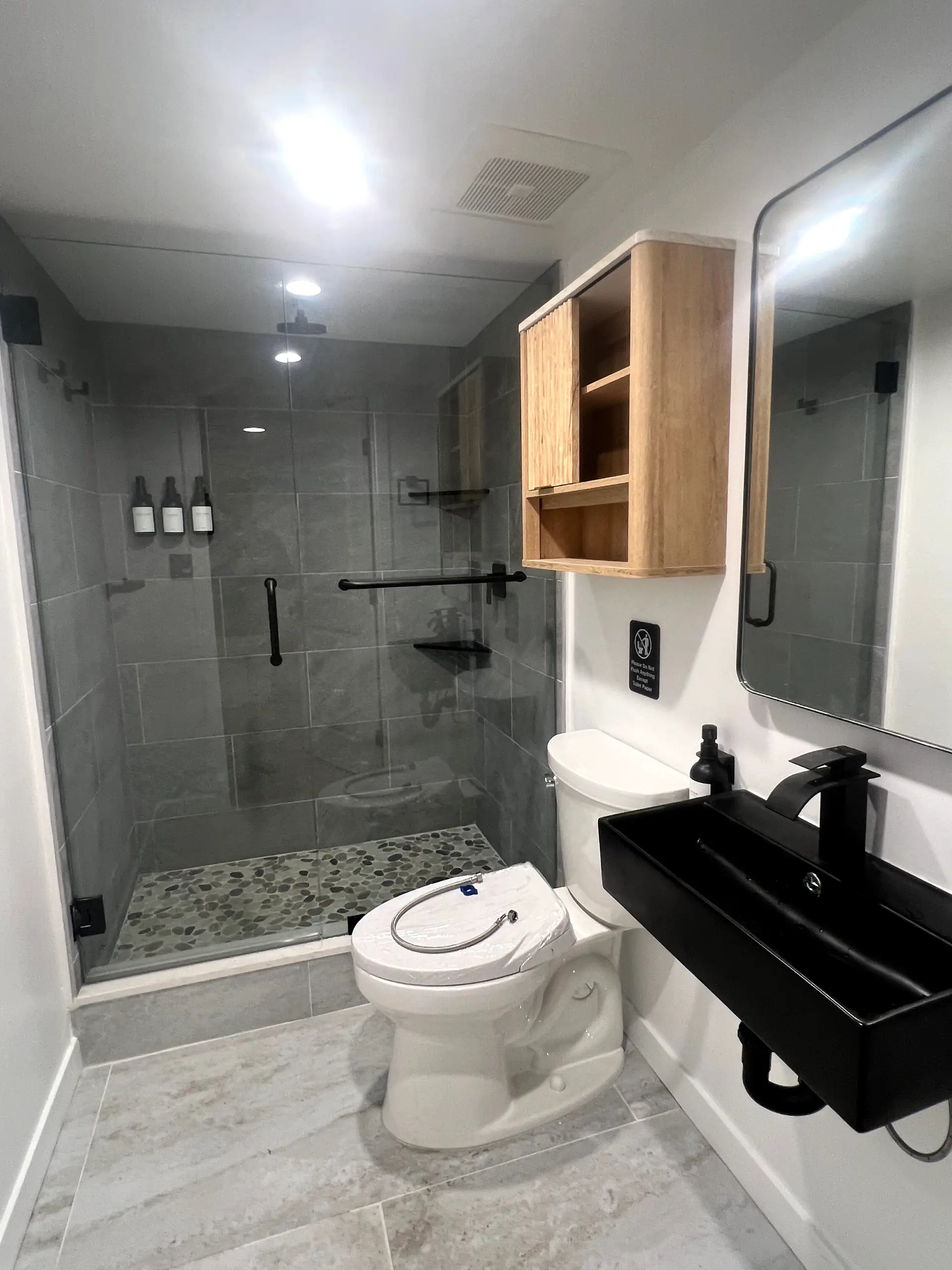 Elegant bathroom transformation with walk-in shower, upgraded tile, and modern fixtures.